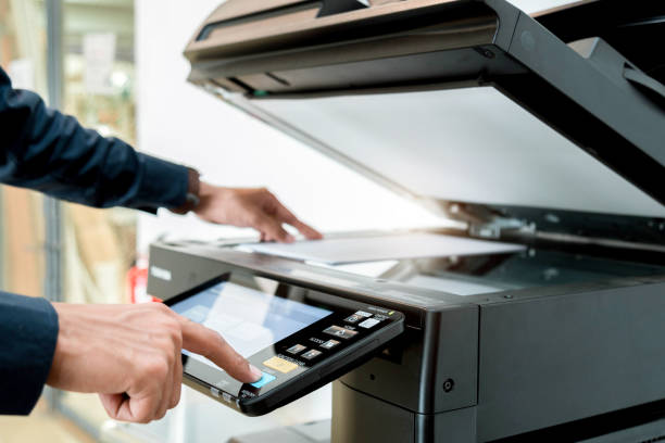 Hand use copier or photocopier or photocopy machine office equipment workplace for scanner or scanning document or printer for printing paperwork hard copy duplicate Xerox service maintenance repair.