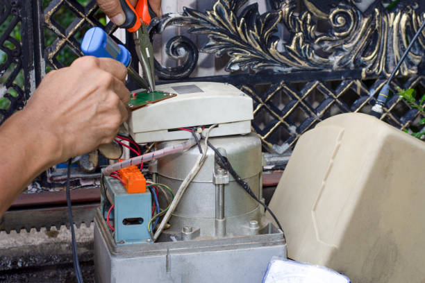Technician man hand holding and using soldering iron to test and check the functional of the motor gear of remote control of auto door Maintenance concept.