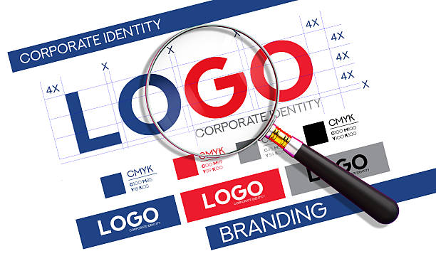 A magnifying glass closely examines a logo on a corporate identity and branding guide, highlighting the meticulous process of brand development. The document includes grid lines for precision, color swatches with CMYK values, and various logo mockups, illustrating the creation of a strong visual identity. This image is perfect for graphic designers, marketing agencies, and businesses to represent concepts like brand strategy, logo creation, quality control, and the importance of a well-defined corporate identity.